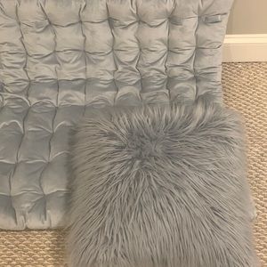 Blue fluffy pillow and matching headboard. Used for college dorm.